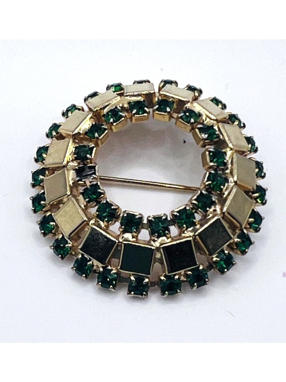 Vintage brooch with green stones on gold tone metal